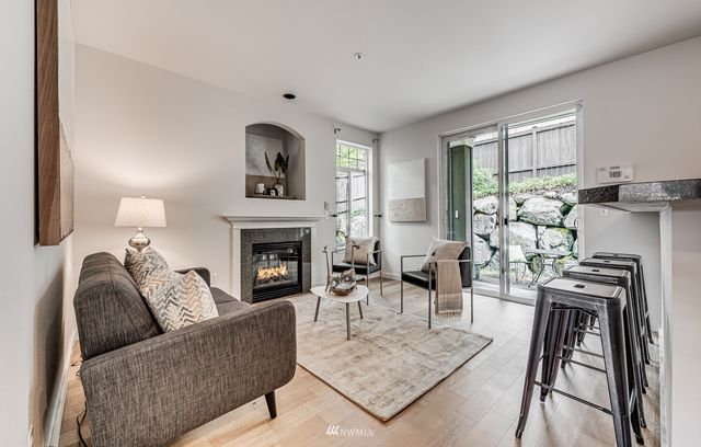 a living room with furniture and a window