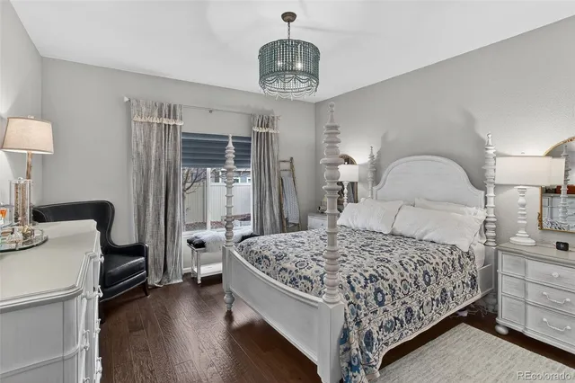 a bedroom with a bed and a book shelf