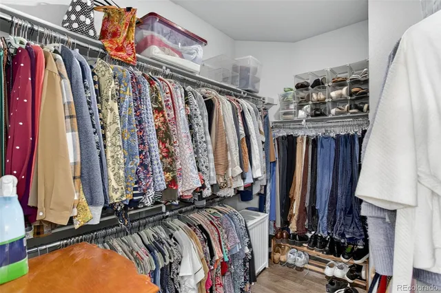 a bedroom with a bed and a dresser in it