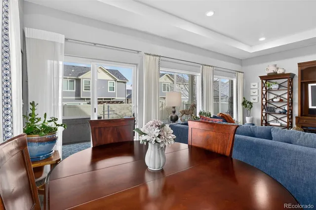 a living room with fireplace furniture and a wooden floor