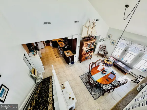 wooden floor with furniture and floor to ceiling window