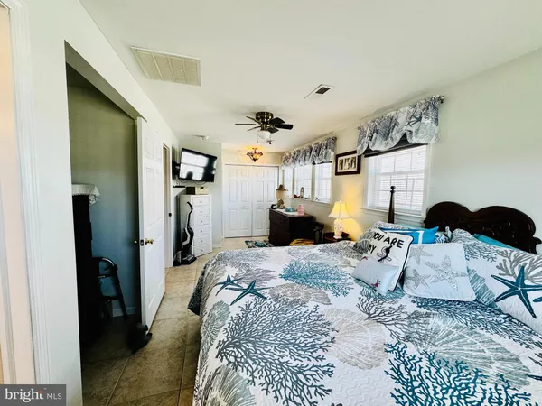 a bed room with a bed window and a couch