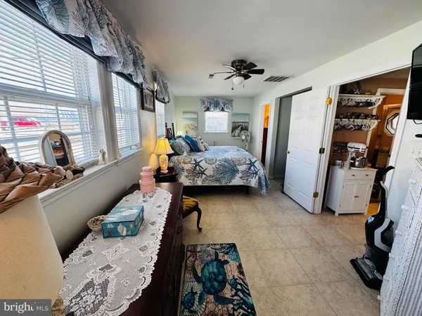 a bedroom with furniture and a window