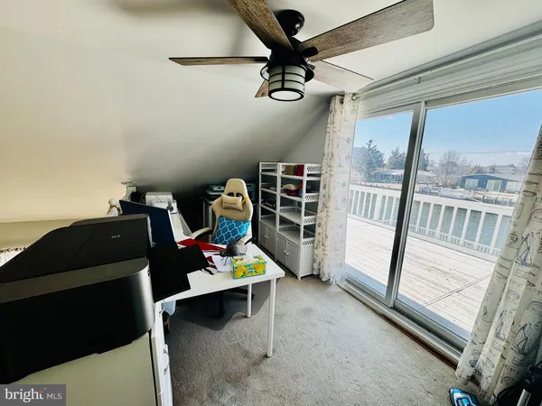 a view of workspace with furniture and windows