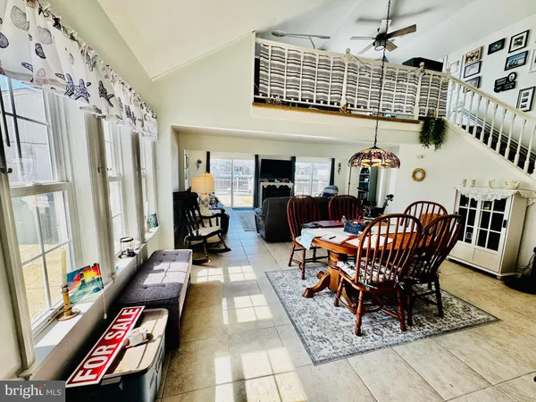 a living room with furniture a rug and a flat screen tv