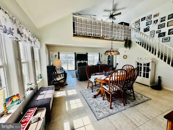 a reading room with furniture rug and a window