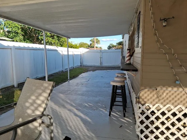 a view of a backyard with furniture