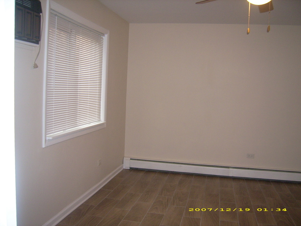 115 East Dundee Road, Unit 1S Wheeling, IL 60090 - Photo 9 of 12 a view of an empty room with a window