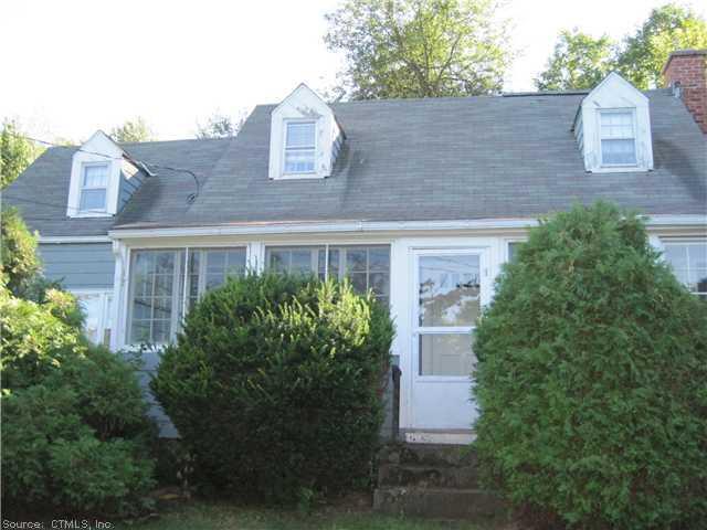 a view of a house with a yard and plants