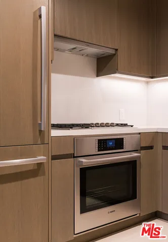 a close view of a stove and a microwave