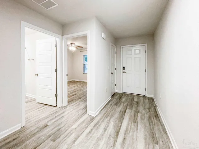 a view of wooden floor in an empty room