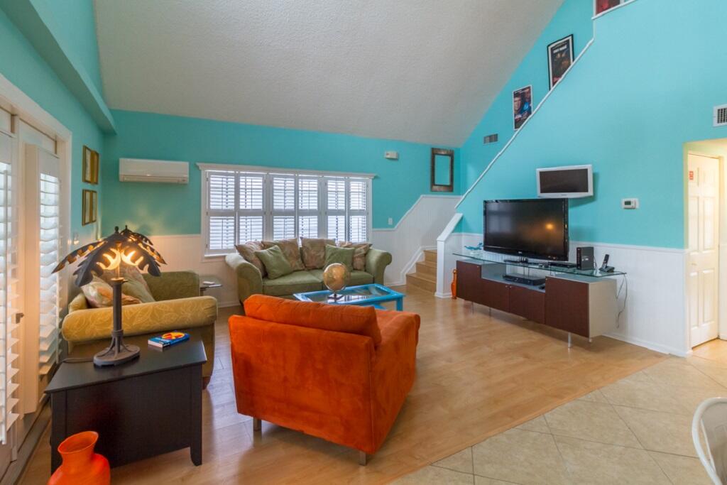 497 Sombrero Beach Road Marathon, FL 33050 - Photo 13 of 33 a living room with furniture and a flat screen tv