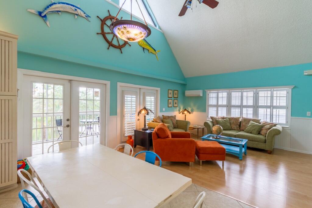 497 Sombrero Beach Road Marathon, FL 33050 - Photo 14 of 33 a living room with furniture and a large window