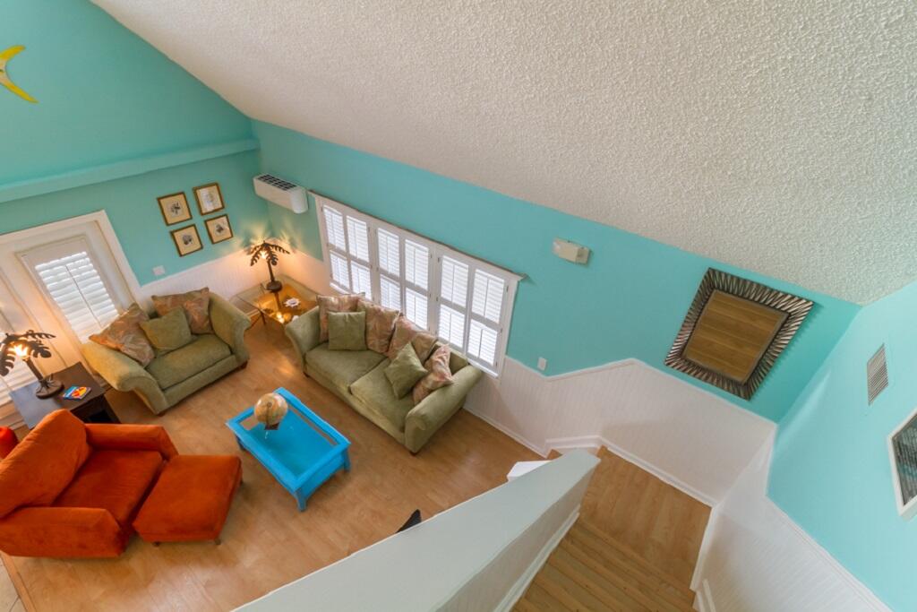 497 Sombrero Beach Road Marathon, FL 33050 - Photo 16 of 33 a living room with furniture and a wooden floor