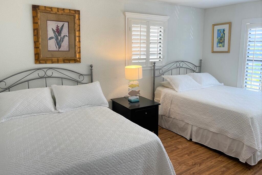 497 Sombrero Beach Road Marathon, FL 33050 - Photo 18 of 33 a bedroom with a bed and a window