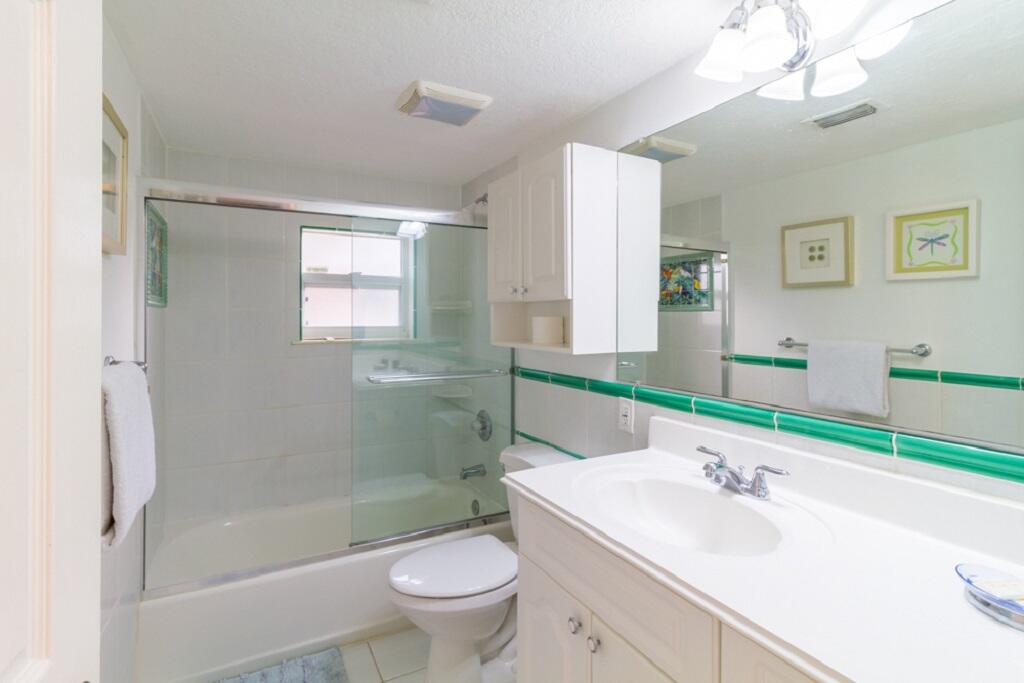 497 Sombrero Beach Road Marathon, FL 33050 - Photo 19 of 33 a bathroom with a sink toilet and shower