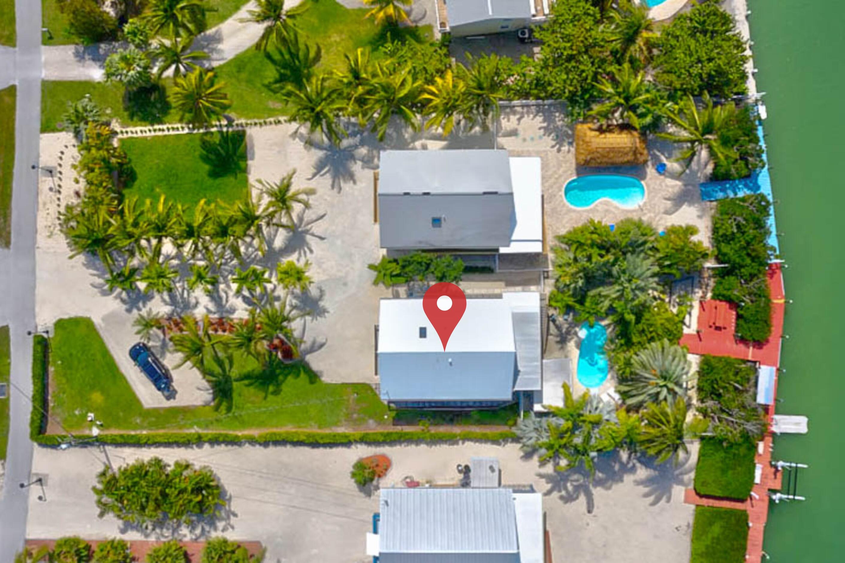 497 Sombrero Beach Road Marathon, FL 33050 - Photo 30 of 33 view of the house with a yard