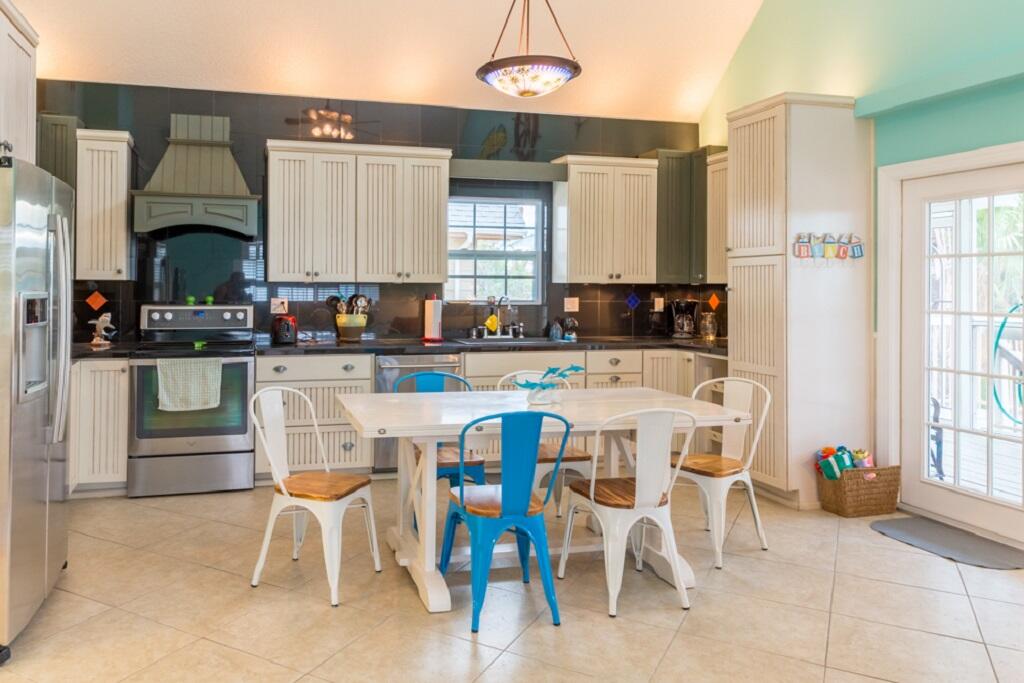 497 Sombrero Beach Road Marathon, FL 33050 - Photo 5 of 33 a dining room with furniture a window and kitchen view