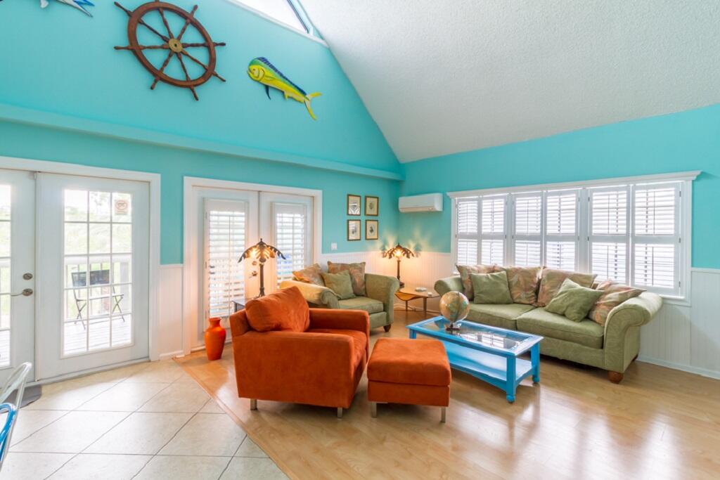 497 Sombrero Beach Road Marathon, FL 33050 - Photo 6 of 33 a living room with furniture and a large window