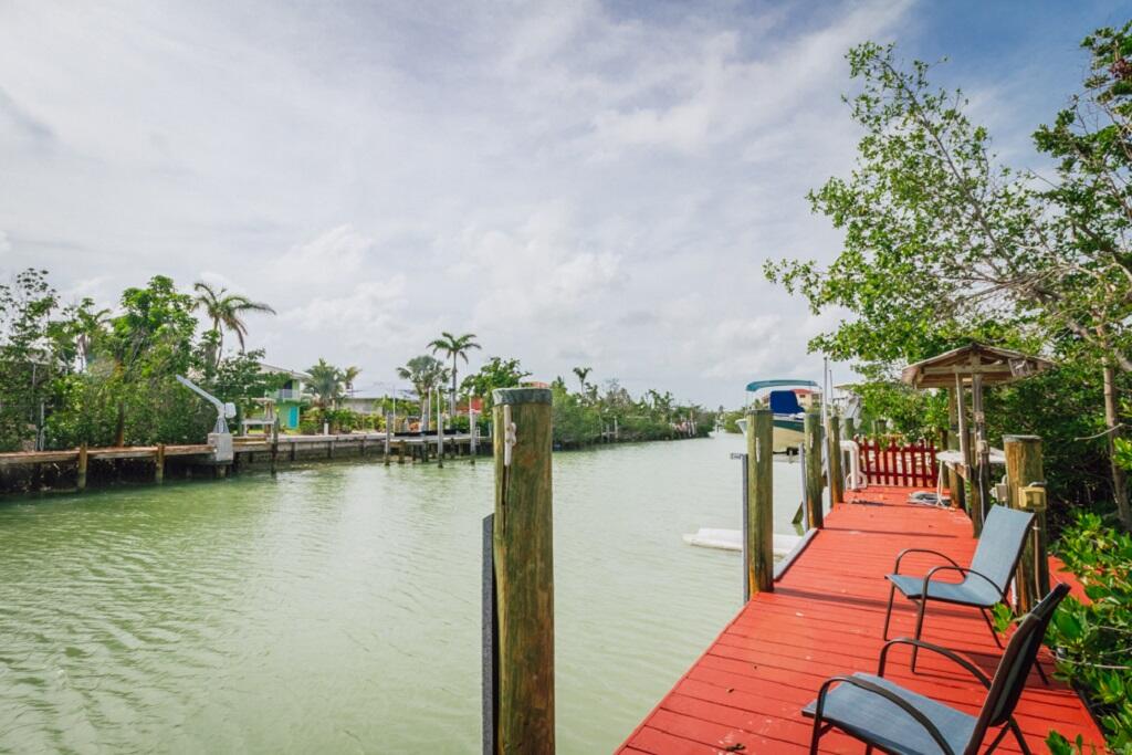 497 Sombrero Beach Road Marathon, FL 33050 - Photo 9 of 33 swimming pool view with a lake view