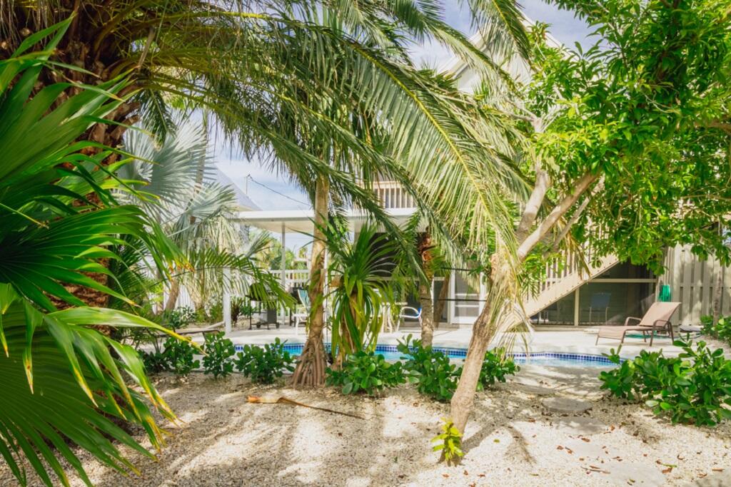 497 Sombrero Beach Road Marathon, FL 33050 - Photo 10 of 33 a front view of a house with a yard