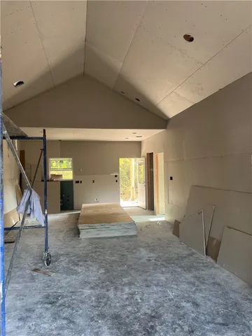 a view of empty room with stairs
