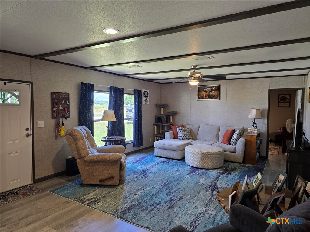 412 Coryell City Road Gatesville, TX 76528 - Photo 3 of 34 a living room with furniture and wooden floor