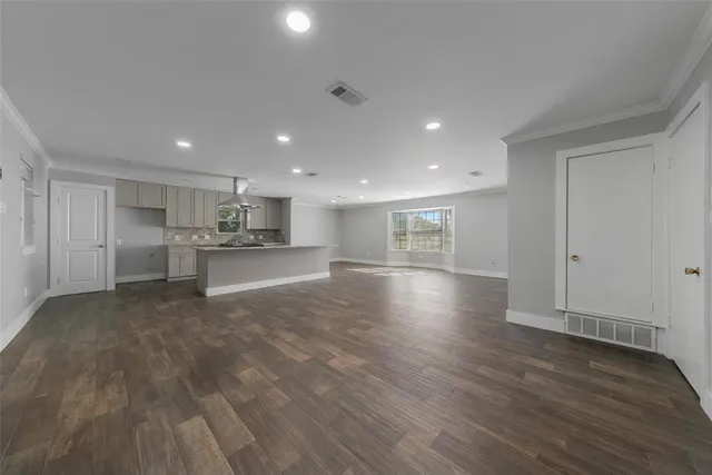 a view of kitchen with refrigerator and window