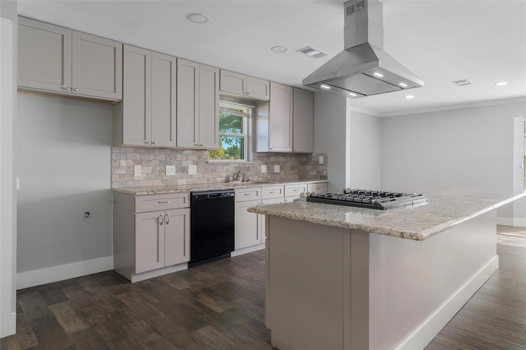 8461 Hunnicut Road Dallas, TX 75228 - Photo 14 of 30 a kitchen with stainless steel appliances granite countertop a sink stove and cabinets