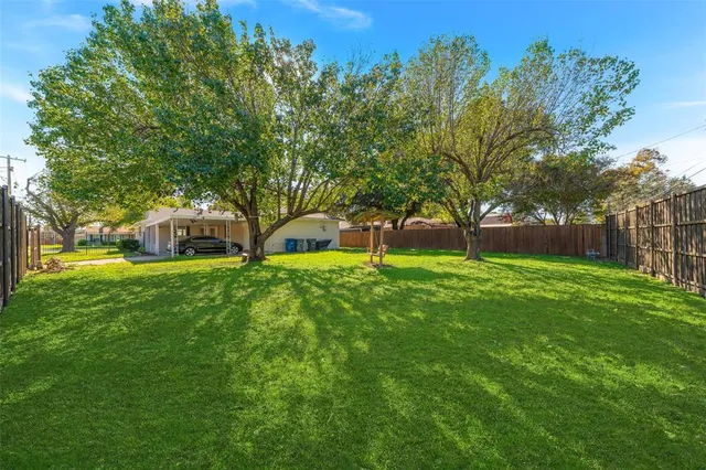 a view of a house with a big yard