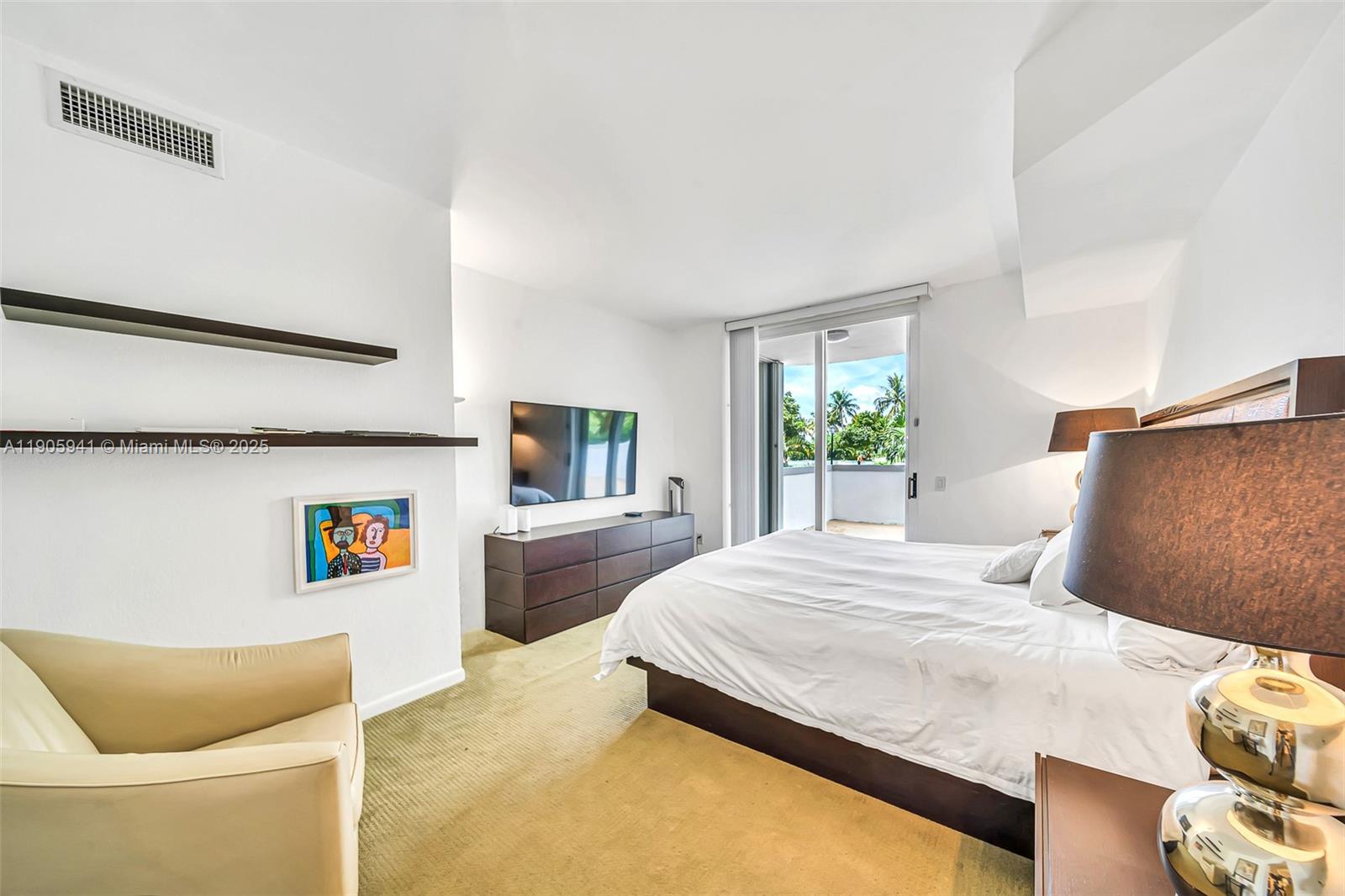 21050 Point Place, Unit 401 Aventura, FL 33180 - Photo 13 of 40 a bedroom with a bed and window