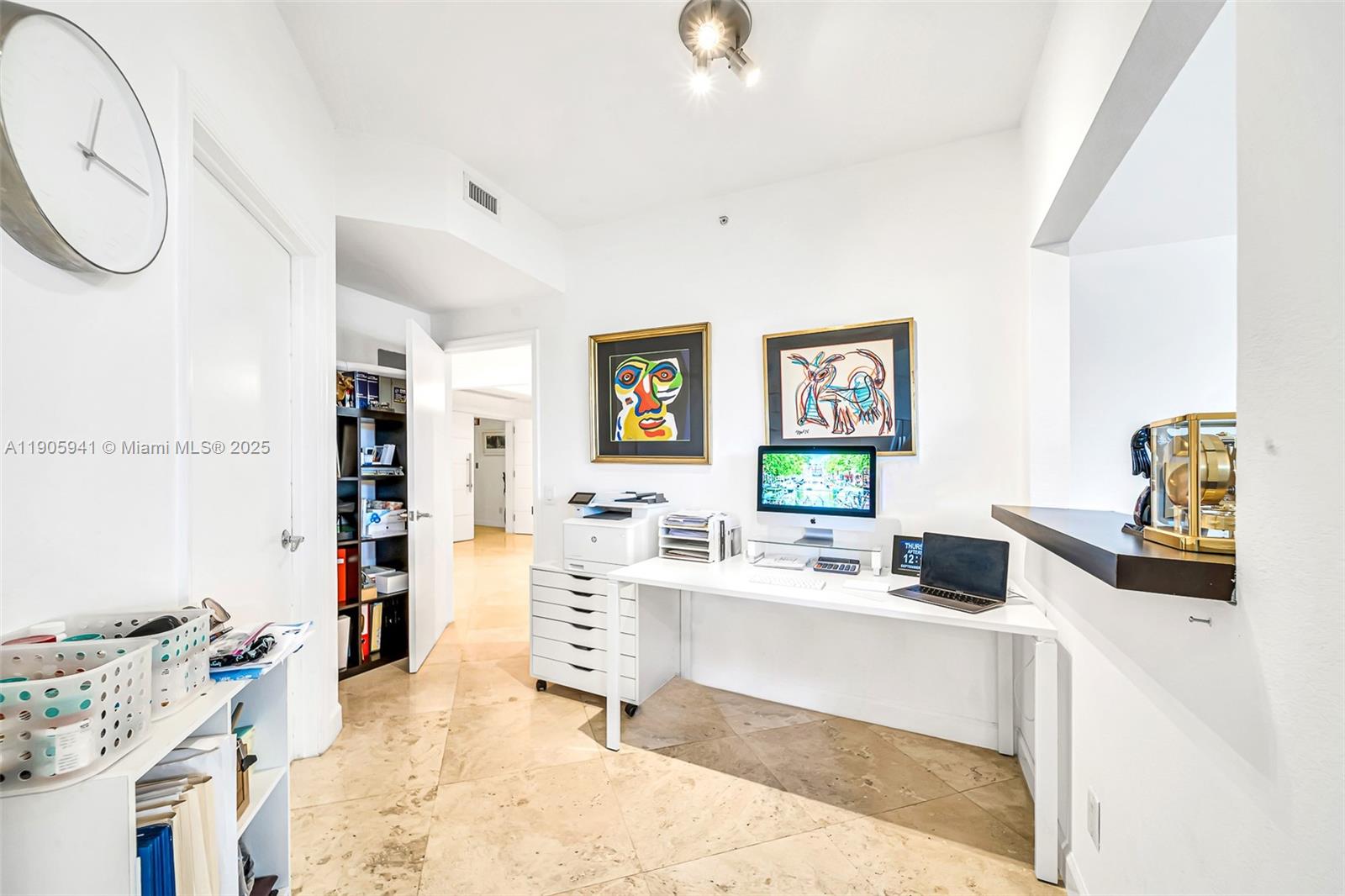 21050 Point Place, Unit 401 Aventura, FL 33180 - Photo 17 of 40 a living room with furniture and a flat screen tv