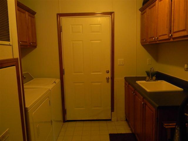 4349 Murfreesboro Road Franklin, TN 37067 - Photo 16 of 20 Utility room with utility sink. Door leads to back yard.