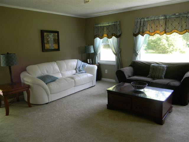 4349 Murfreesboro Road Franklin, TN 37067 - Photo 7 of 20 17X14 Living Room located in the site built portion of the home. New carpet both upstairs and downstairs. Sliding glass doors lead to deck outside.