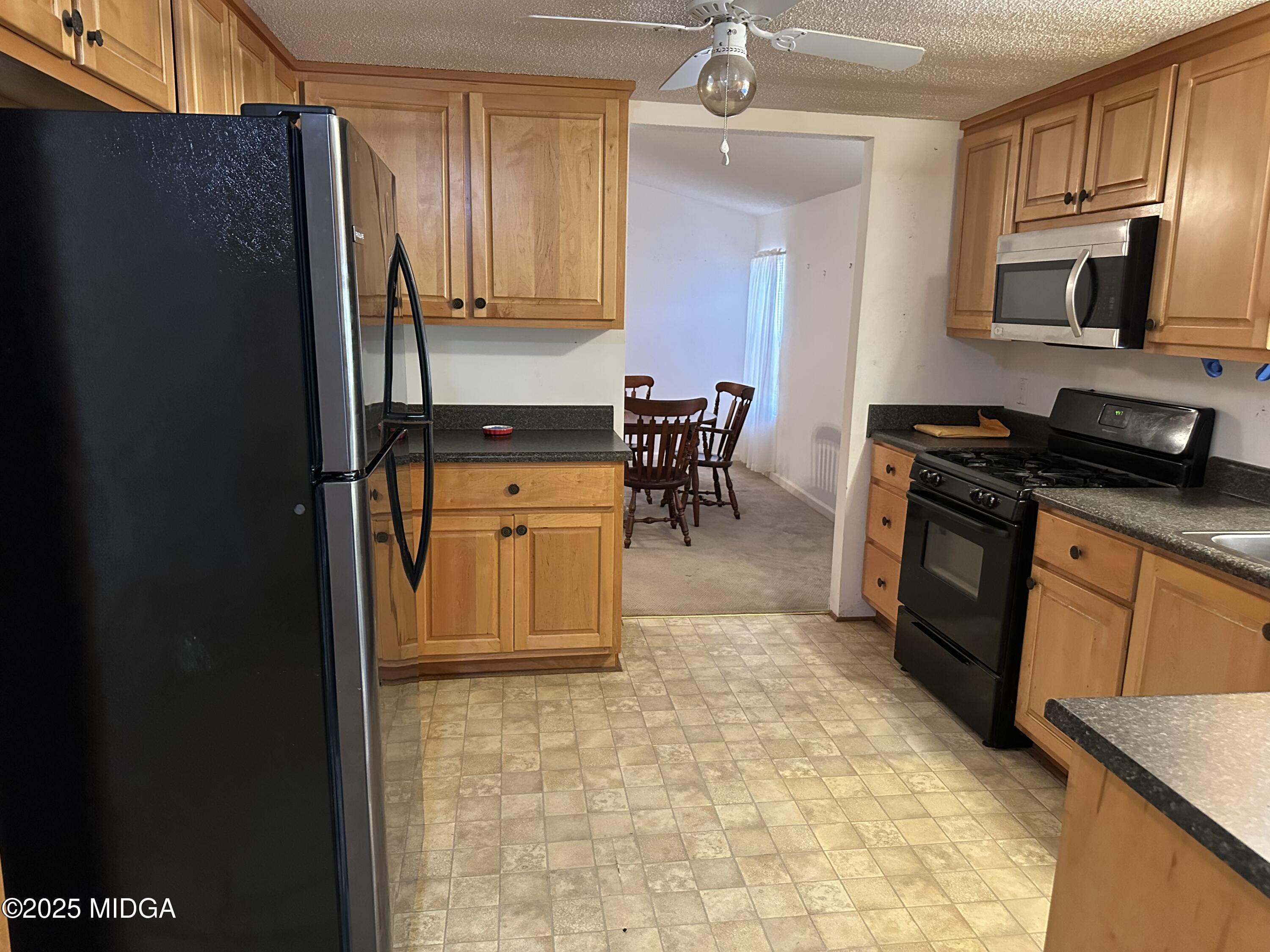 362 Old Macon Road Gray, GA 31032 - Photo 11 of 23 a kitchen with stainless steel appliances granite countertop a refrigerator stove top oven and sink
