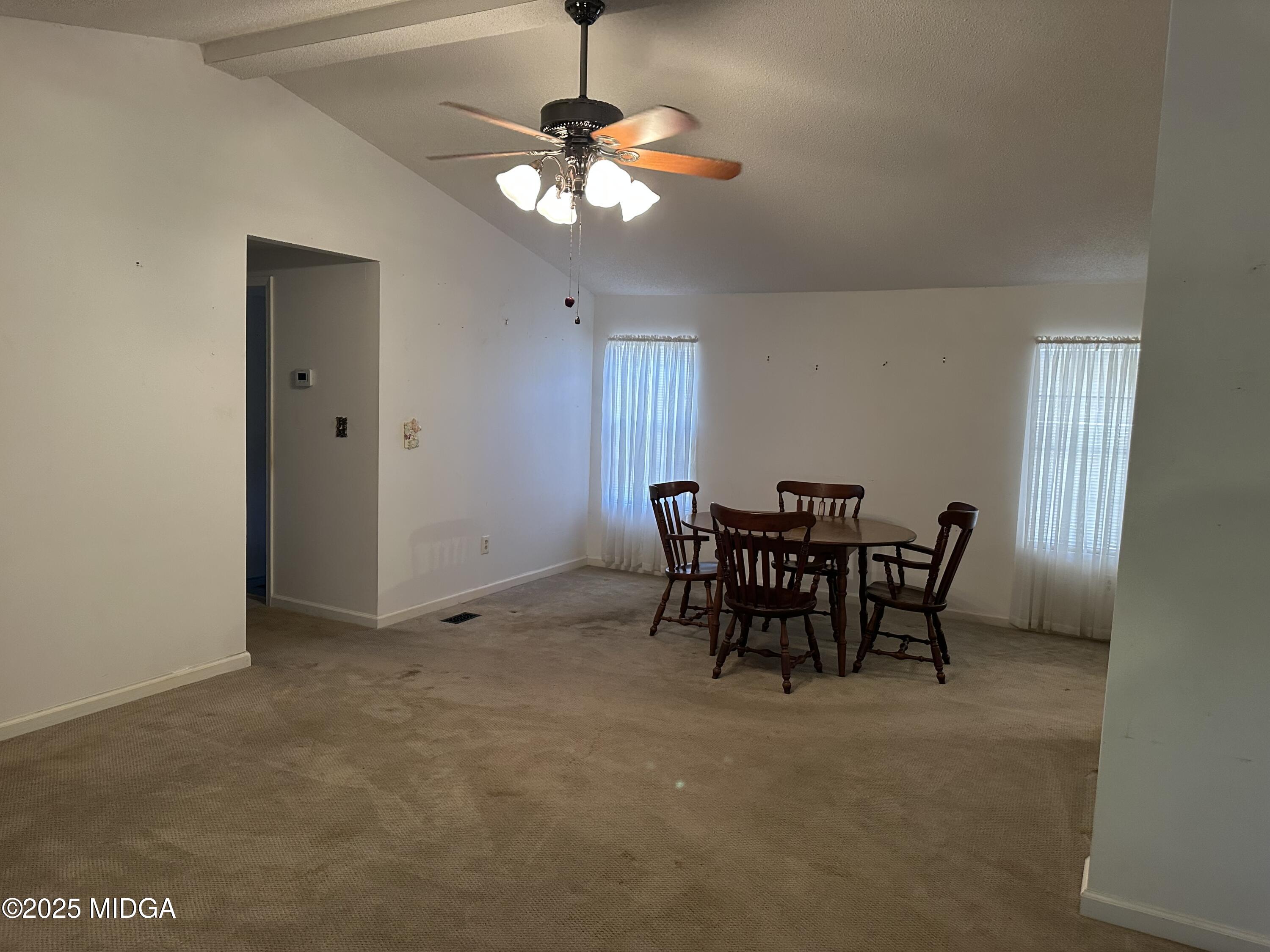 362 Old Macon Road Gray, GA 31032 - Photo 12 of 23 a view of a dining room with furniture and chandelier