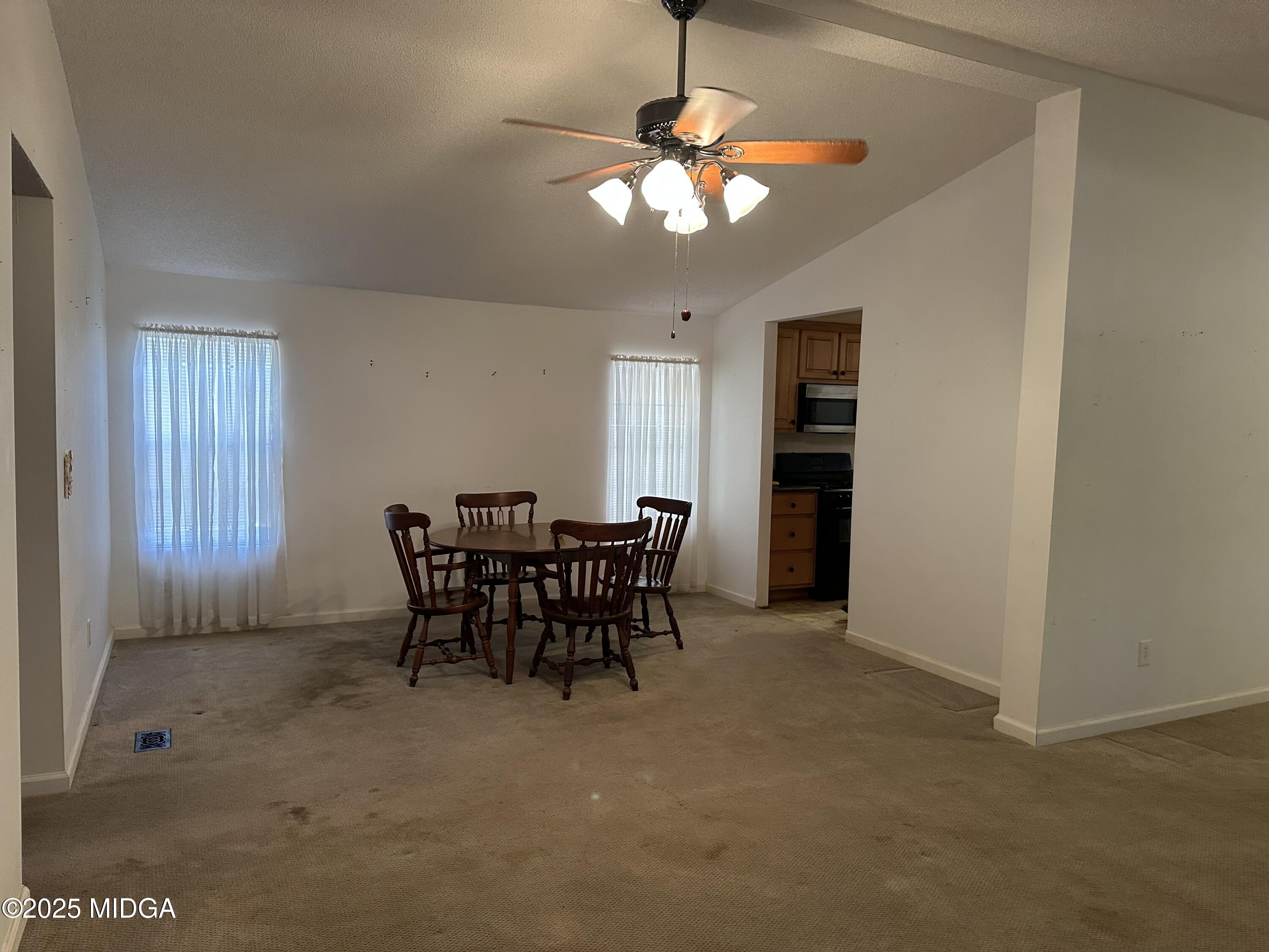 362 Old Macon Road Gray, GA 31032 - Photo 13 of 23 a view of a dining room with furniture and chandelier