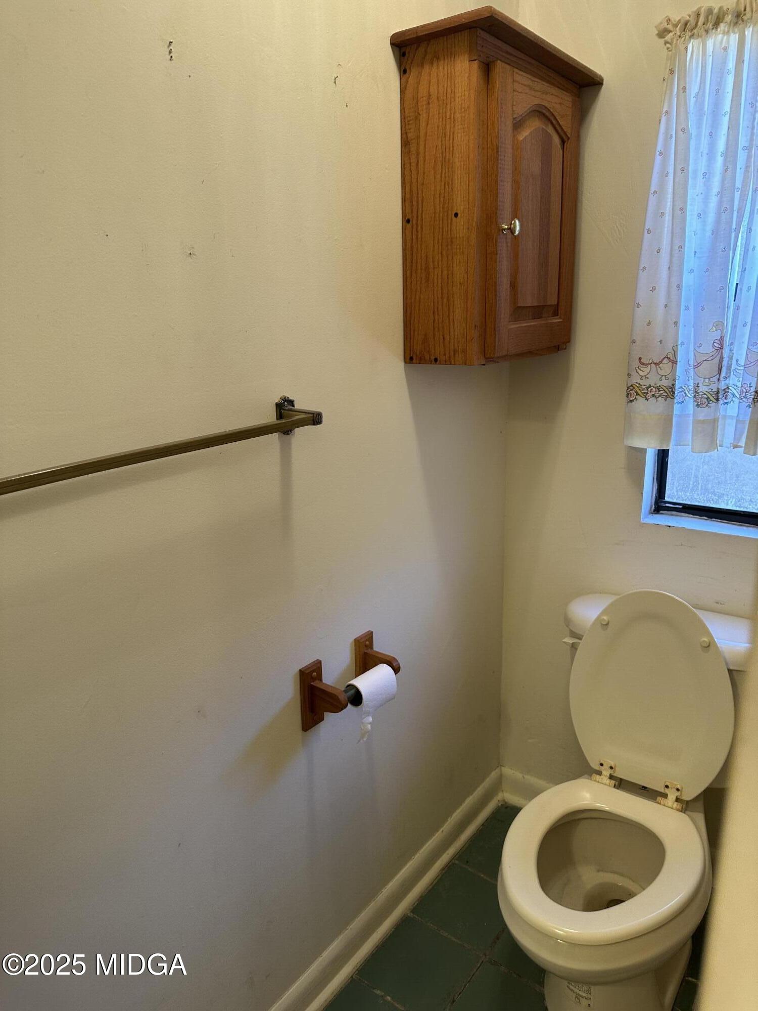 362 Old Macon Road Gray, GA 31032 - Photo 19 of 23 a bathroom with a toilet and a mirror