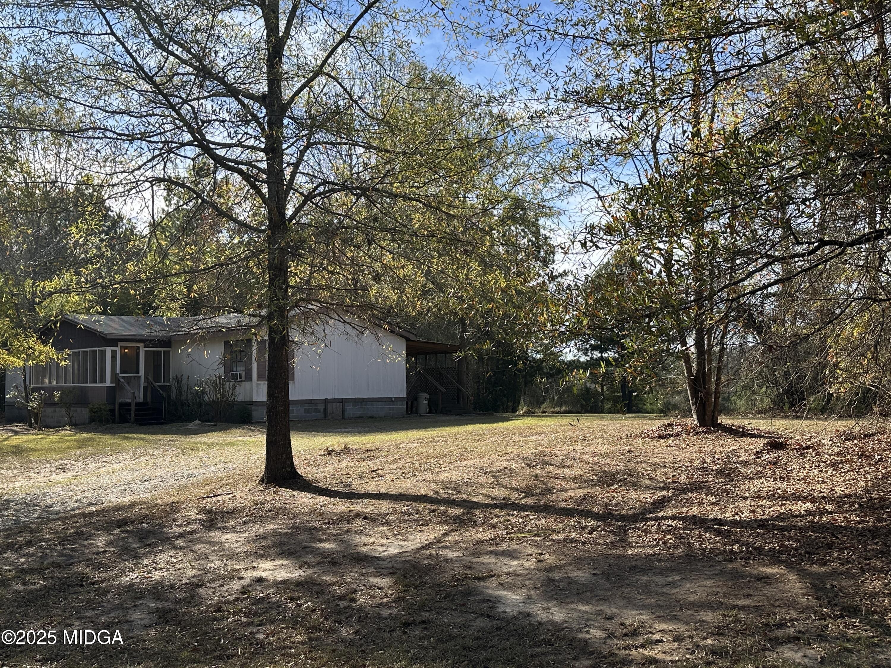 362 Old Macon Road Gray, GA 31032 - Photo 3 of 23 a tree is standing in the yard