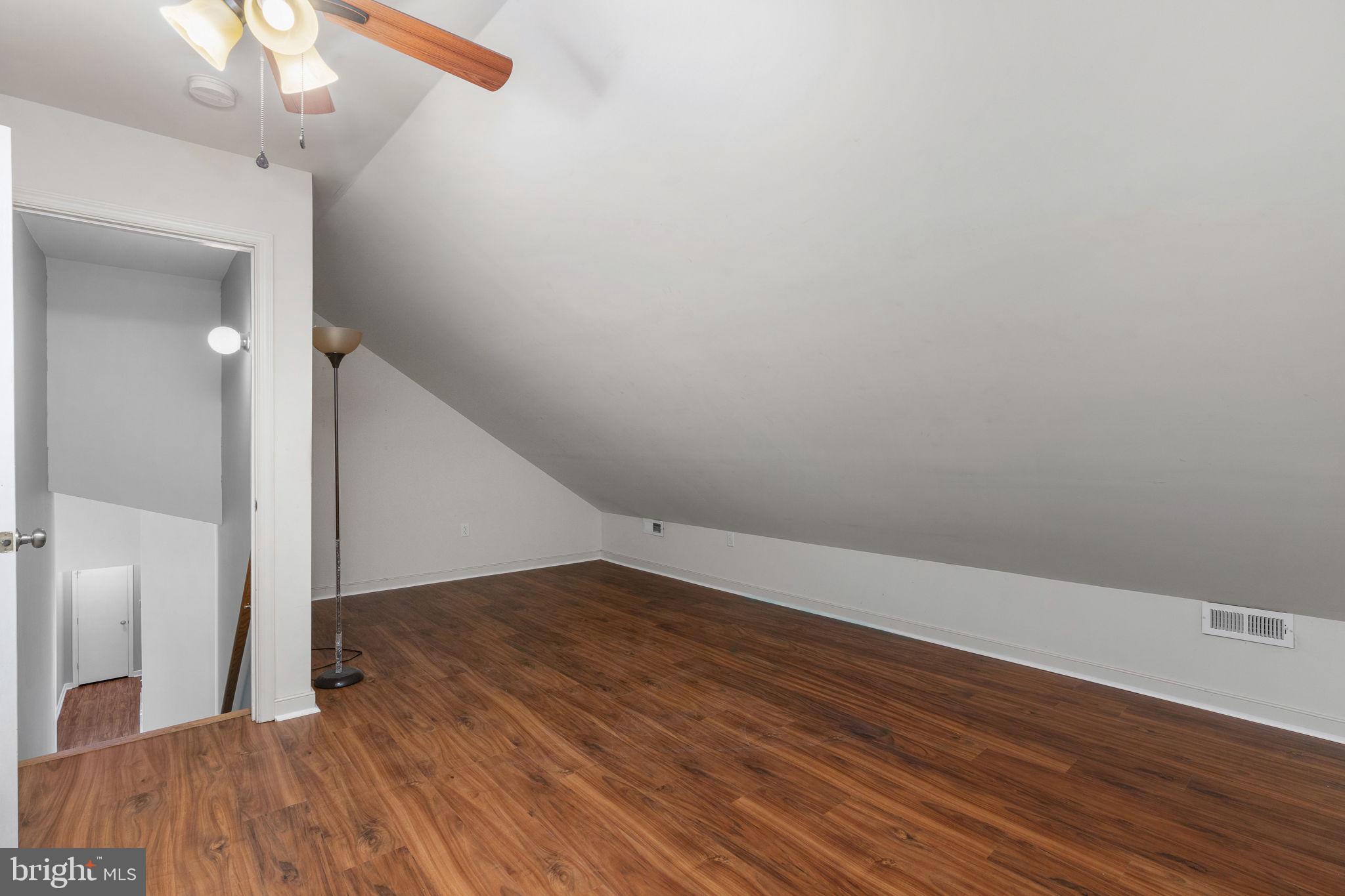 8009 Burrell Road Fredericksburg, VA 22407 - Photo 16 of 66 Cozy attic space with sloped ceiling.