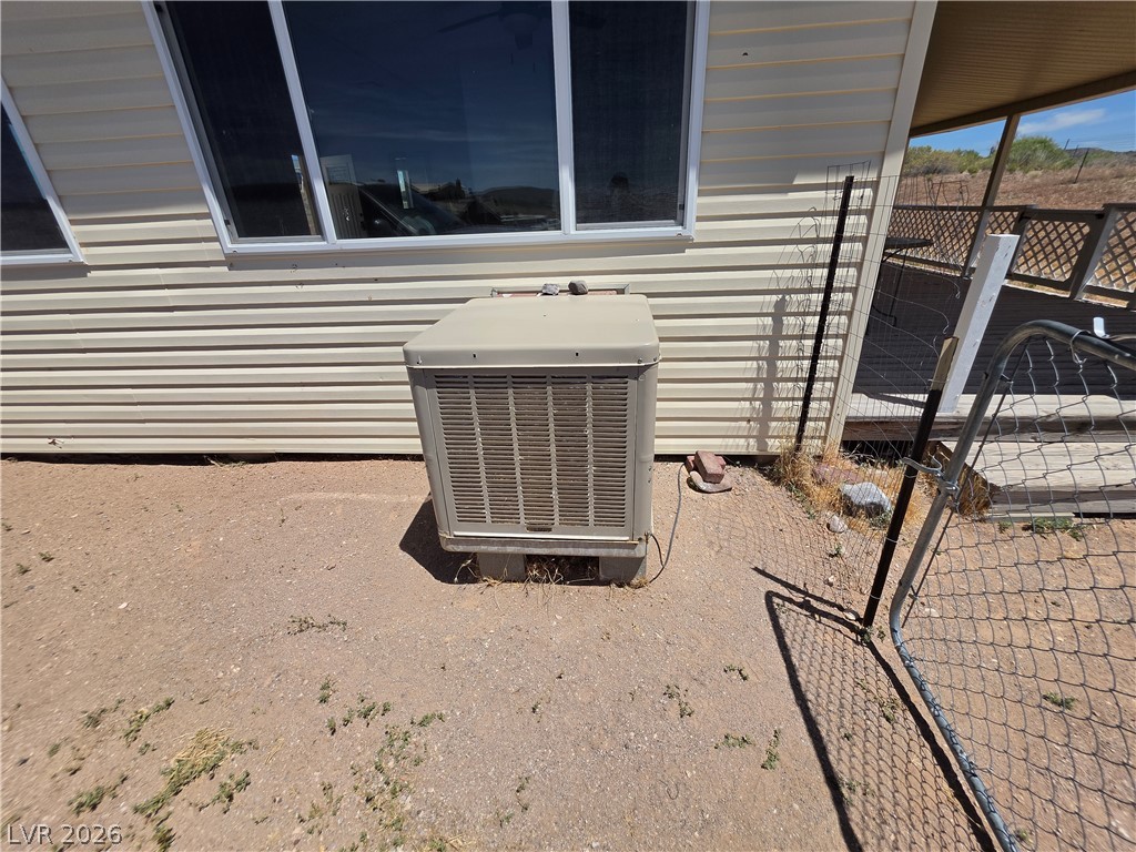 2930 Frehner Ranch Road Pioche, NV 89043 - Photo 7 of 39 An essential cooling unit ensures comfort, nestled beside the home's exterior.