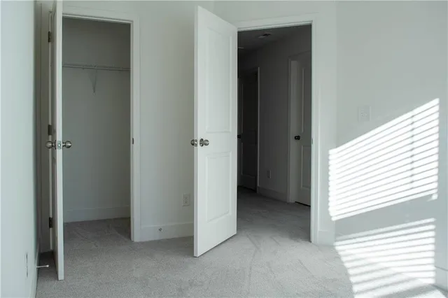 a view of an empty room with windows