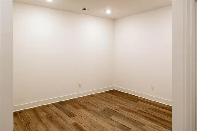 a view of room with wooden floor