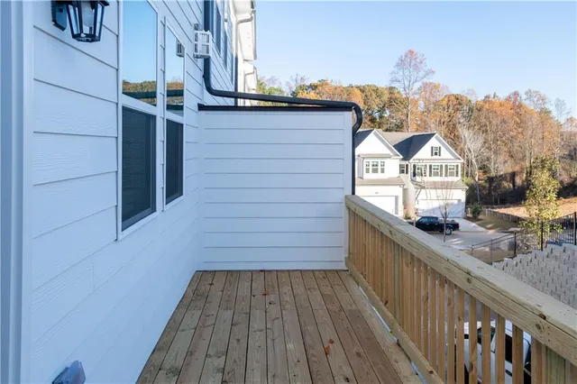 a view of a house with wooden deck