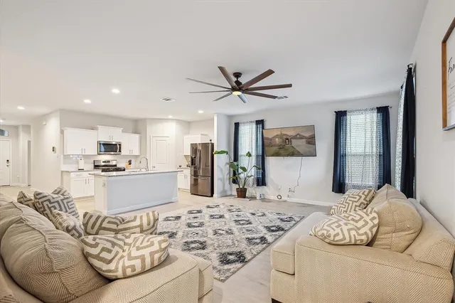 a living room with kitchen furniture and kitchen view