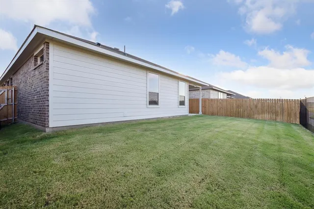 a backyard of a house with lots of green space