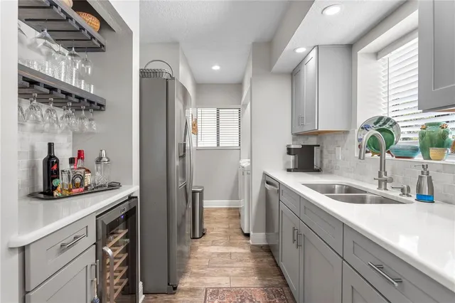 a kitchen with a sink and cabinets