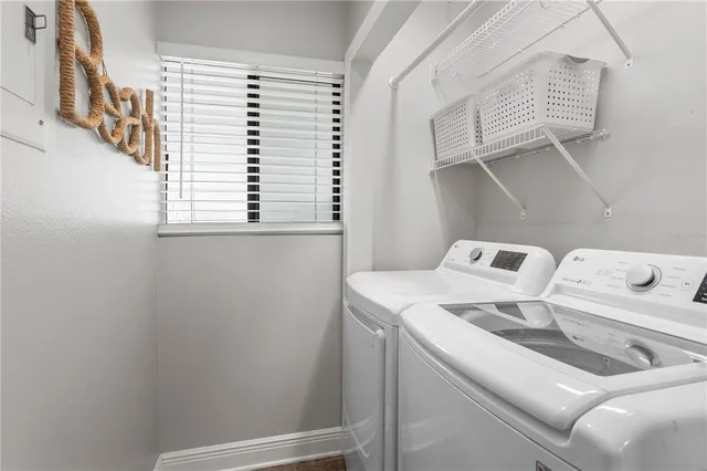 a view of storage and utility room with washer and dryer