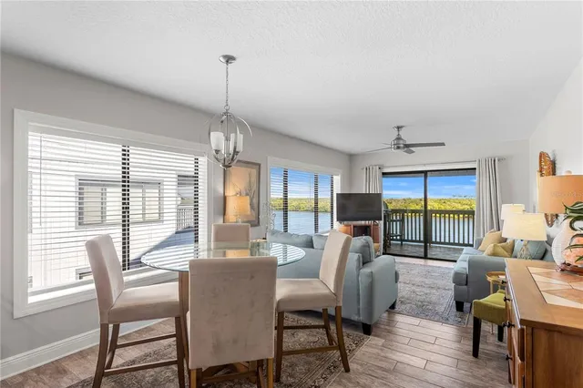 a view of a dining room with furniture window and outside view