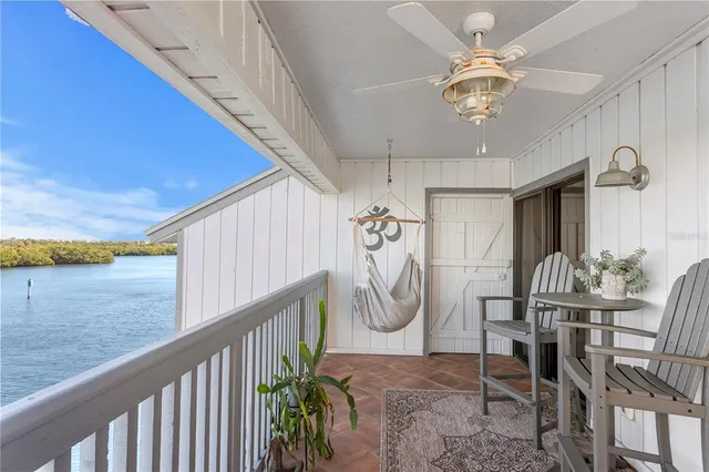 a view of a livingroom with furniture and staircase